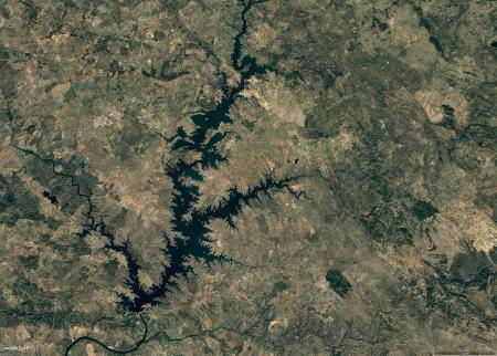 Bird view of Alqueva region map with flooded water streams after closure of reservoir gates